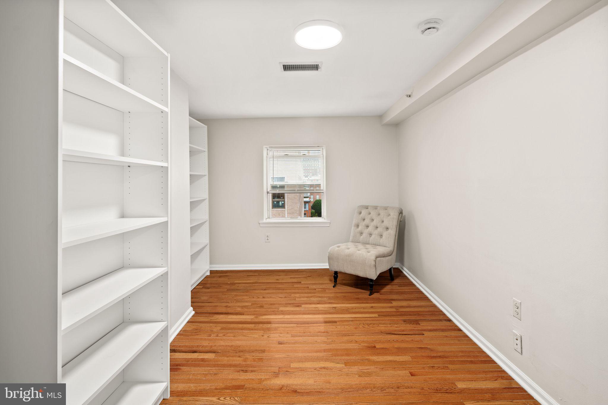 303 South 11th Street, Unit 9 Philadelphia, PA 19107 - Photo 12 of 36 a room with a bed and cabinets