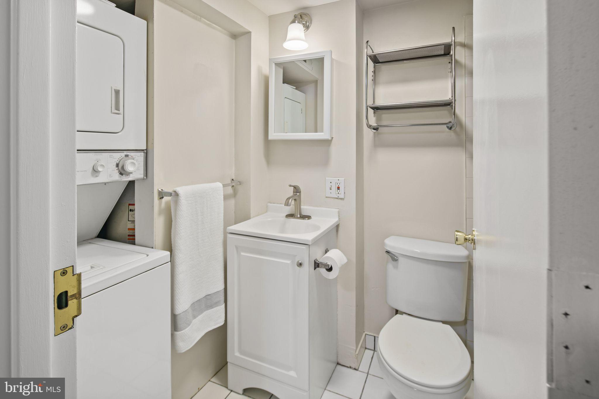 303 South 11th Street, Unit 9 Philadelphia, PA 19107 - Photo 16 of 36 a white toilet sitting next to a bathroom sink