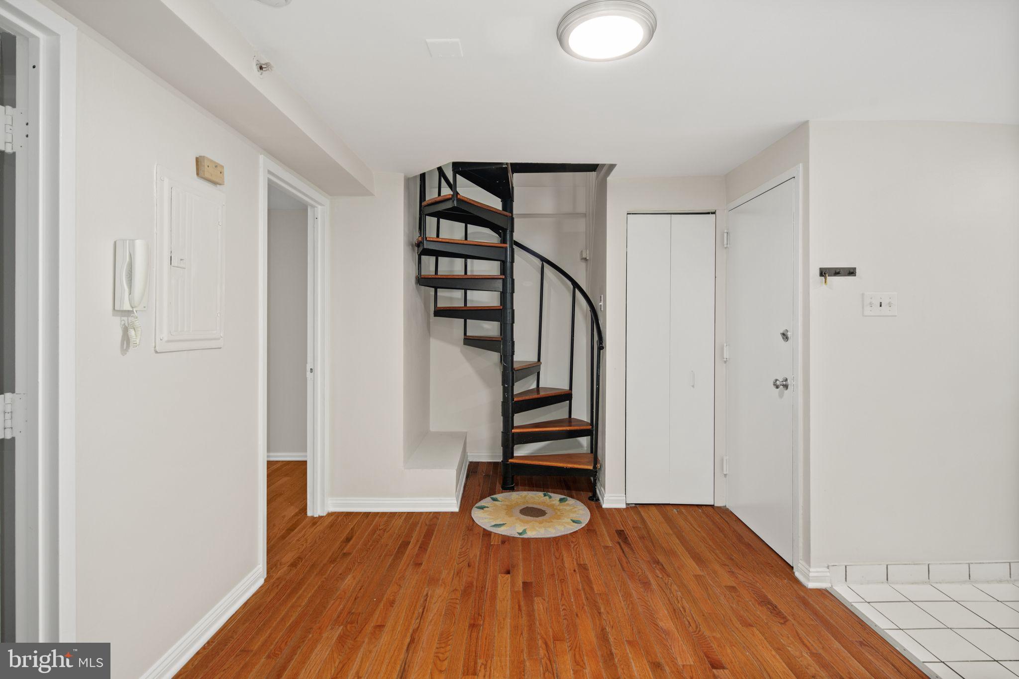303 South 11th Street, Unit 9 Philadelphia, PA 19107 - Photo 20 of 36 a view of entryway with wooden floor
