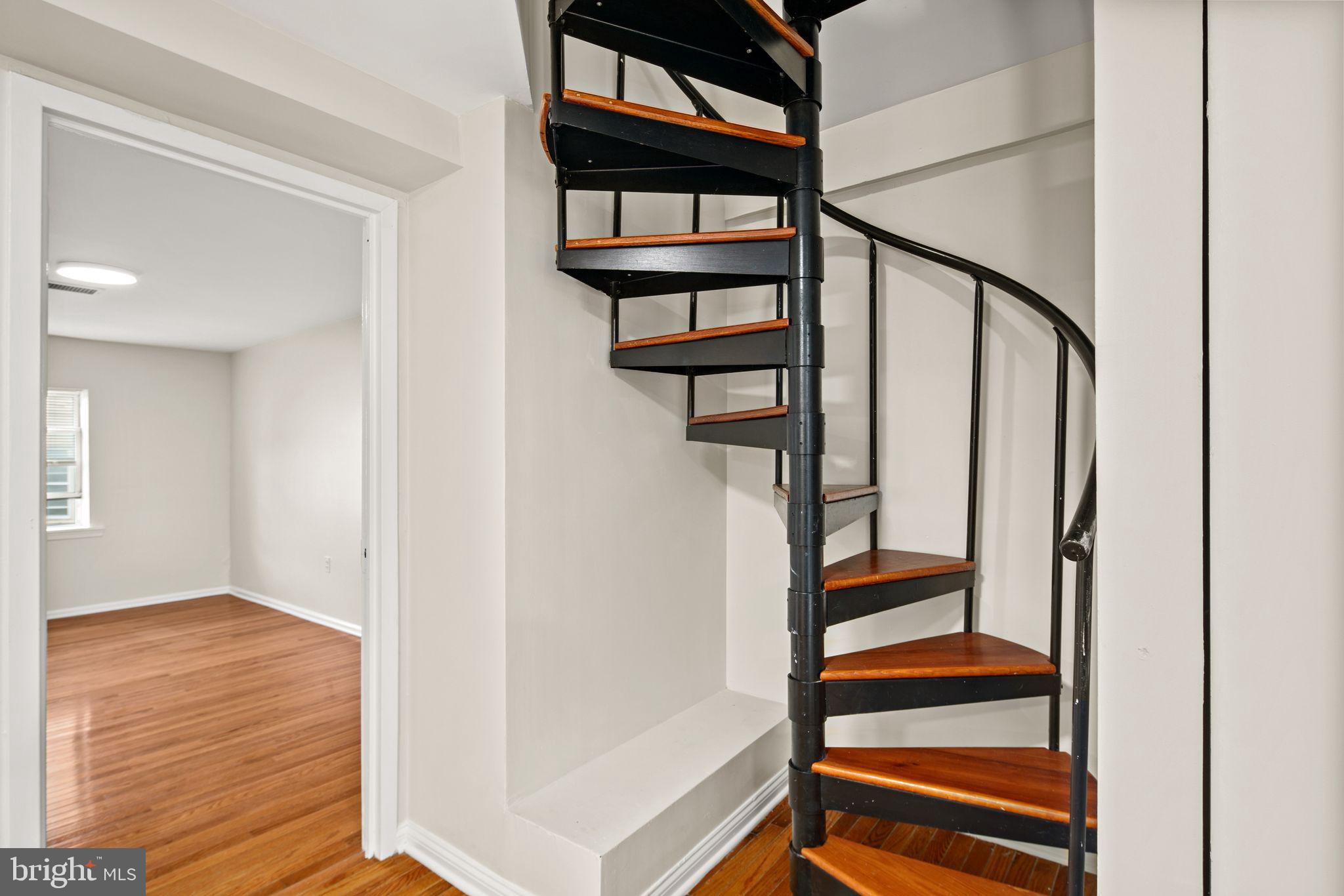 303 South 11th Street, Unit 9 Philadelphia, PA 19107 - Photo 21 of 36 a view of entryway with wooden floor and stairs