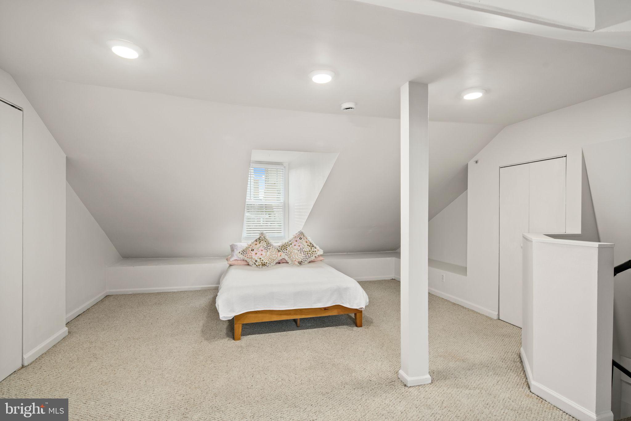 303 South 11th Street, Unit 9 Philadelphia, PA 19107 - Photo 31 of 36 a living room with furniture and a table