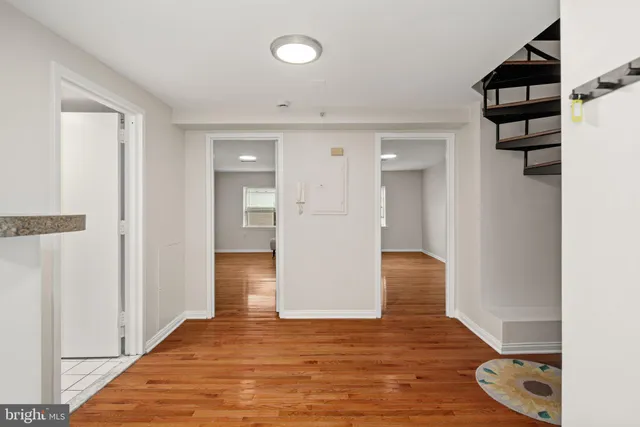 a view of entryway with wooden floor