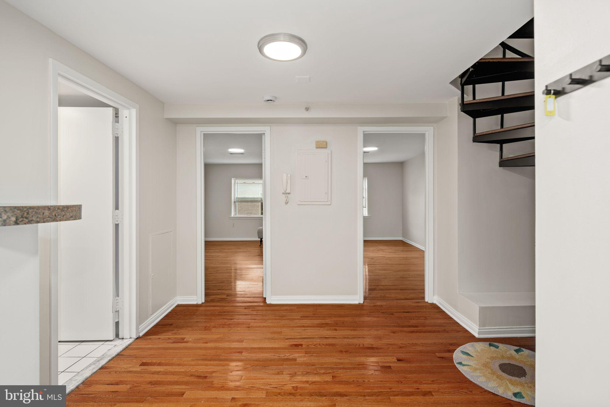 303 South 11th Street, Unit 9 Philadelphia, PA 19107 - Photo 10 of 36 a view of entryway with wooden floor