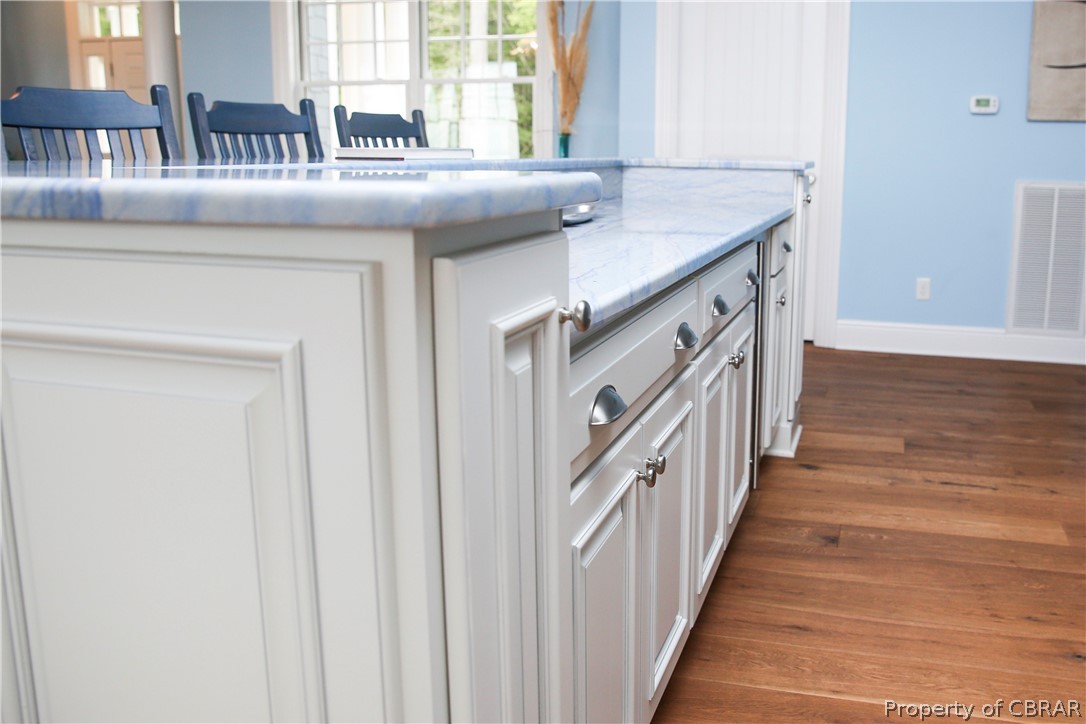 1000 Queenstown Road Lancaster, VA 22503 - Photo 40 of 49 a hallway with granite countertop a sink and dishwasher with a dining table