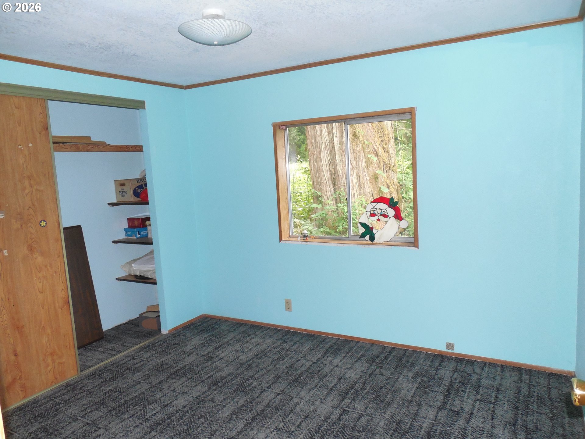 41180 Southeast Kubitz Road Sandy, OR 97055 - Photo 23 of 35 a view of an empty room with wooden floor and a window