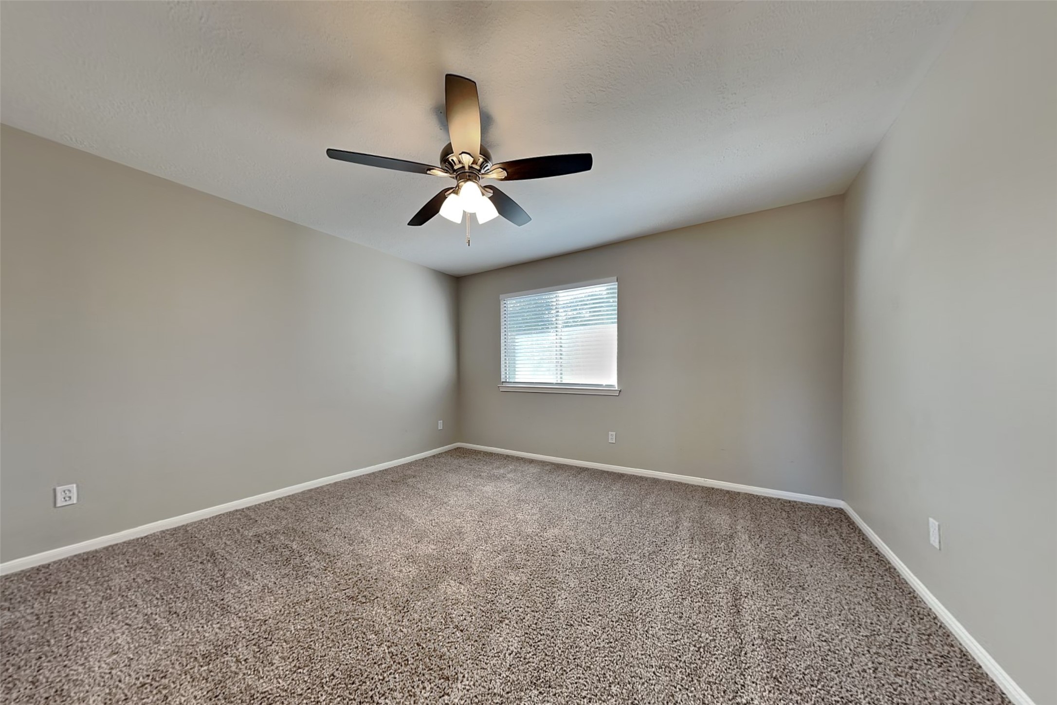 29439 Fox River Drive Spring, TX 77386 - Photo 17 of 29 an empty room with a window and a fan