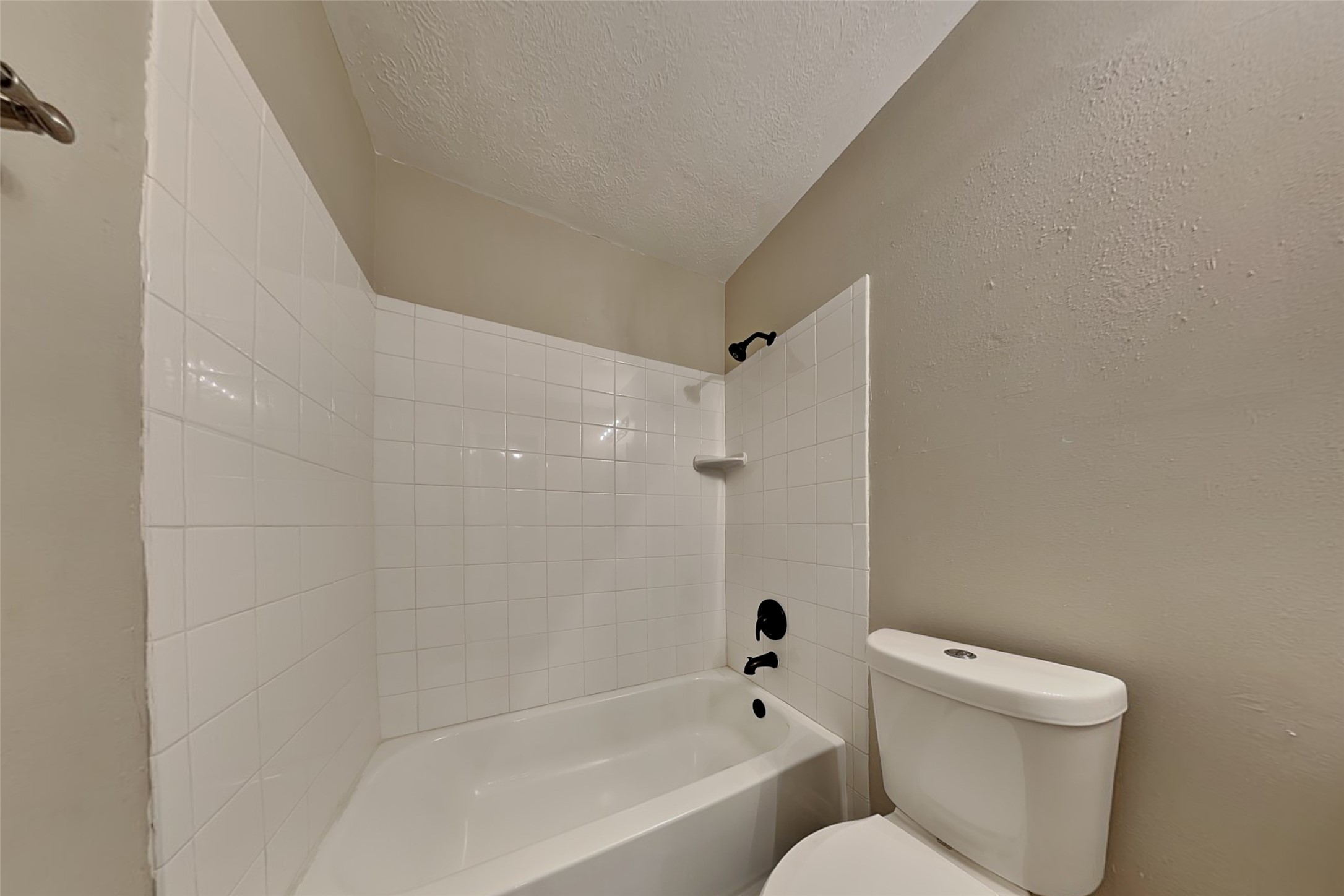 29439 Fox River Drive Spring, TX 77386 - Photo 25 of 29 a bathroom with a toilet and a bathtub