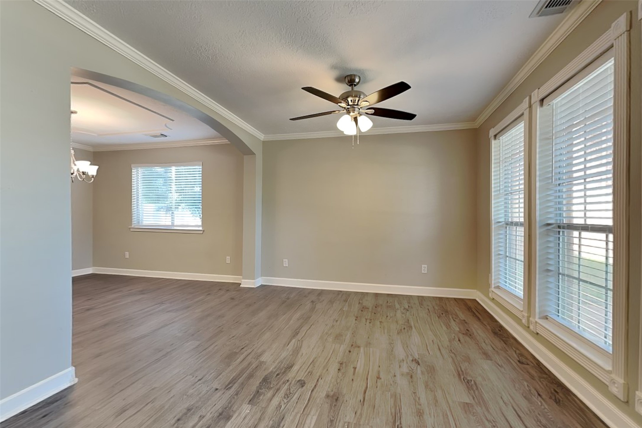 29439 Fox River Drive Spring, TX 77386 - Photo 4 of 29 a view of an empty room with a window and wooden floor