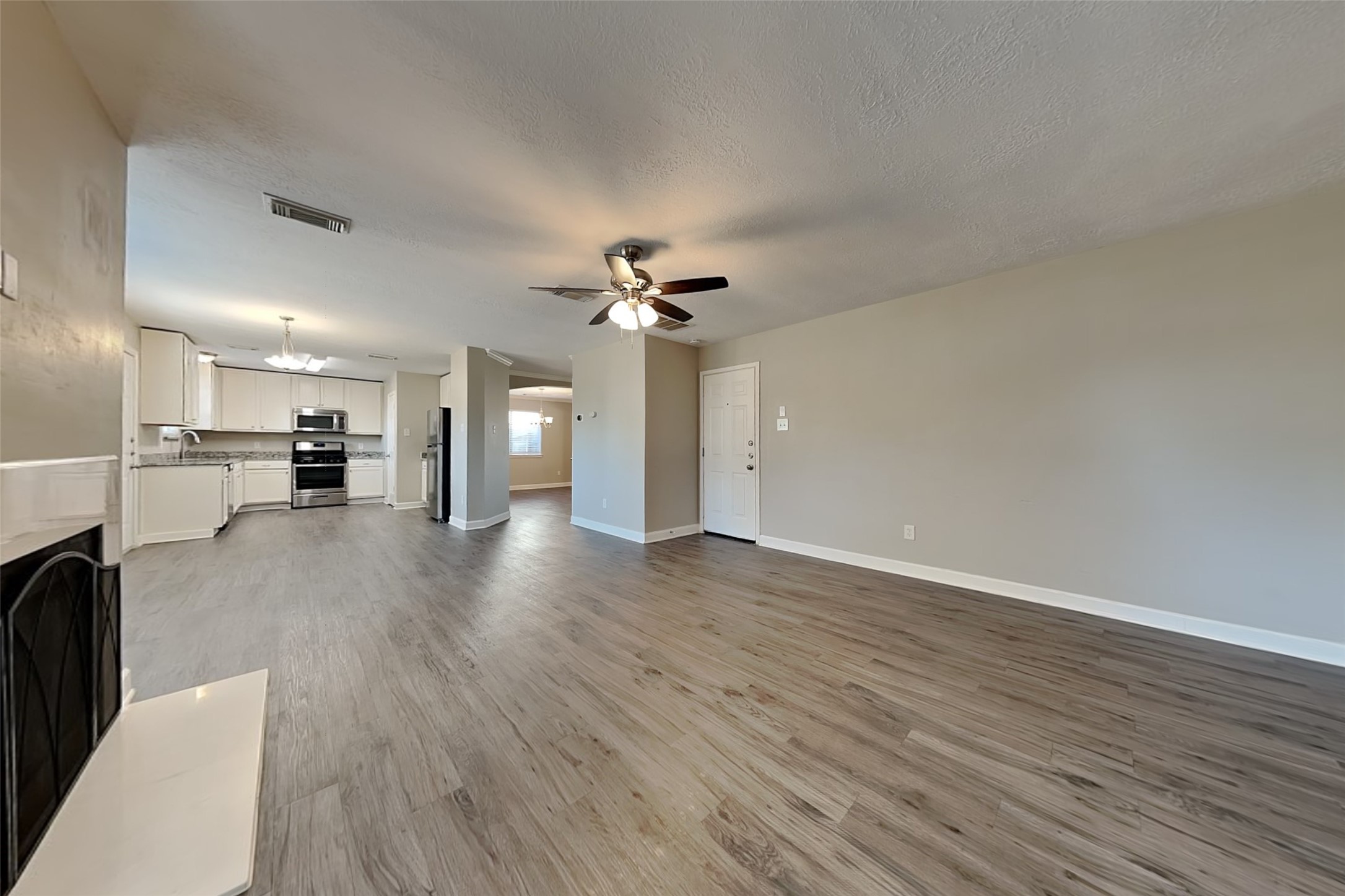 29439 Fox River Drive Spring, TX 77386 - Photo 5 of 29 a view of a kitchen with a sink and a stove top oven