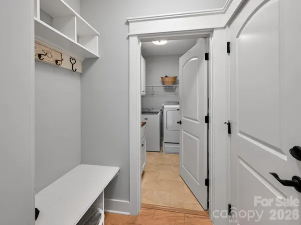 a bathroom with a sink and glass door