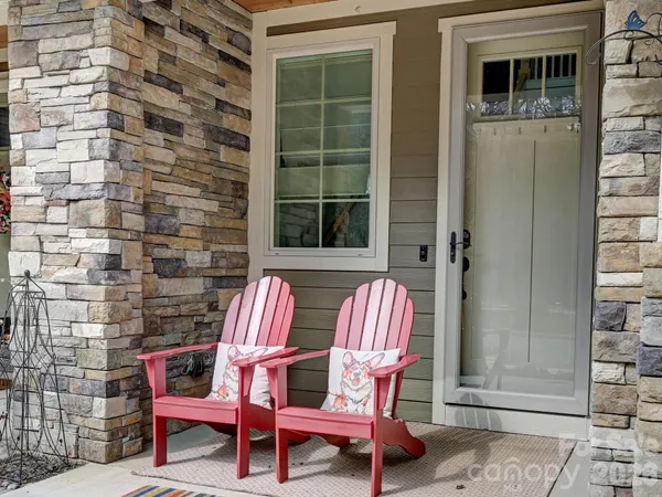 a chair and a table in a balcony
