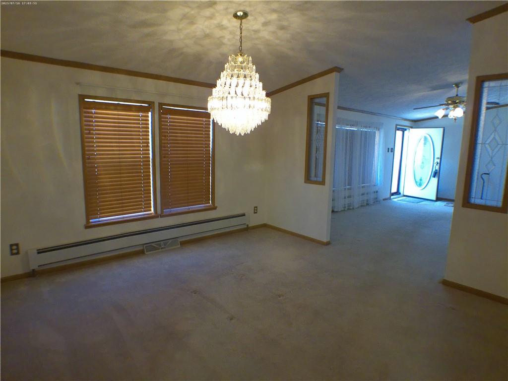 107 Hunting Hill Road Dilliner, PA 15327 - Photo 13 of 24 a view of a livingroom with a chandelier fan and windows