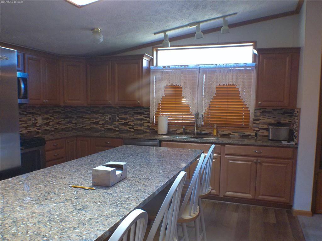 107 Hunting Hill Road Dilliner, PA 15327 - Photo 19 of 24 a kitchen with large window and cabinets