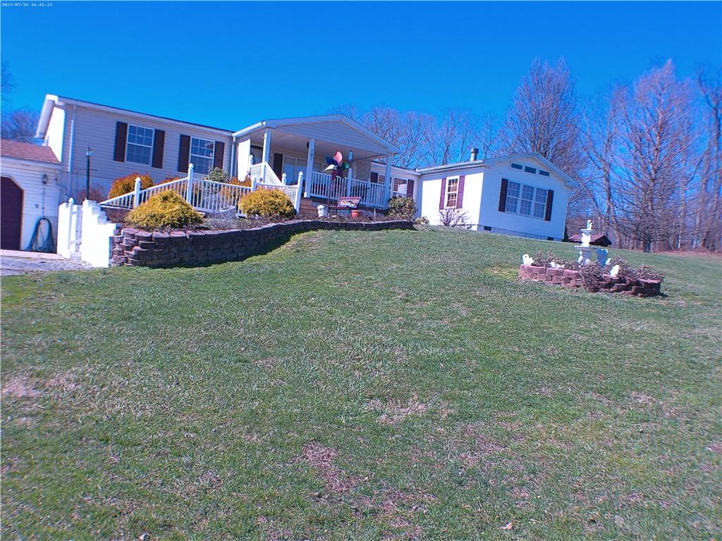 107 Hunting Hill Road Dilliner, PA 15327 - Photo 2 of 24 a front view of a house with garden