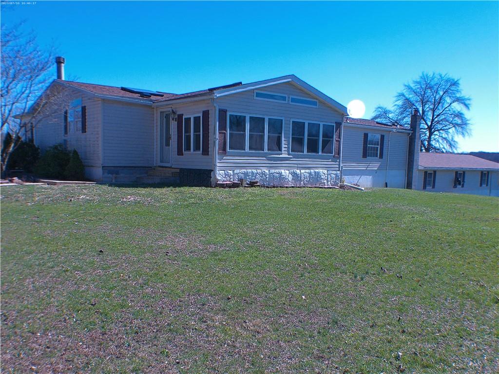 107 Hunting Hill Road Dilliner, PA 15327 - Photo 4 of 24 a view of a house with a yard