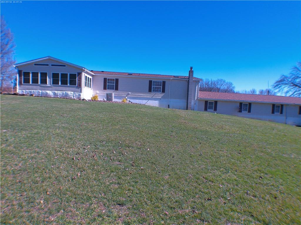 107 Hunting Hill Road Dilliner, PA 15327 - Photo 5 of 24 a view of a house with a yard