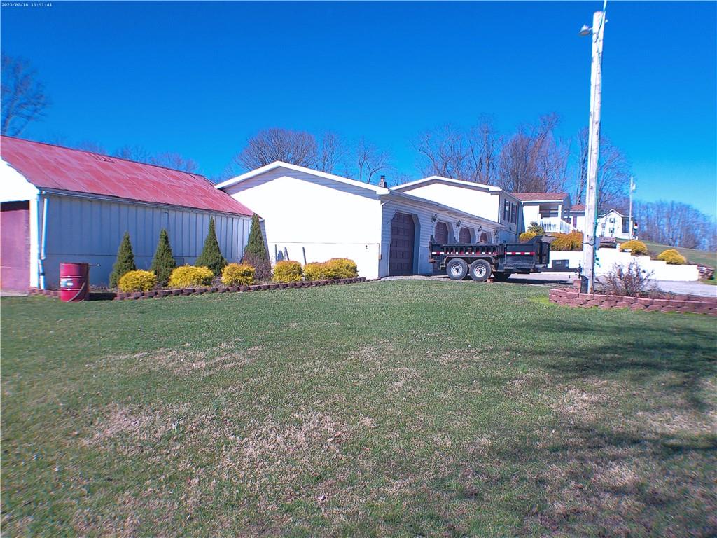 107 Hunting Hill Road Dilliner, PA 15327 - Photo 9 of 24 a view of a house with backyard