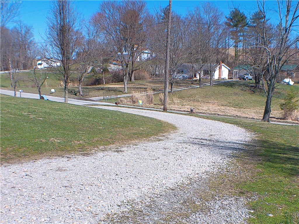 107 Hunting Hill Road Dilliner, PA 15327 - Photo 10 of 24 a view of a swimming pool with a house in the background