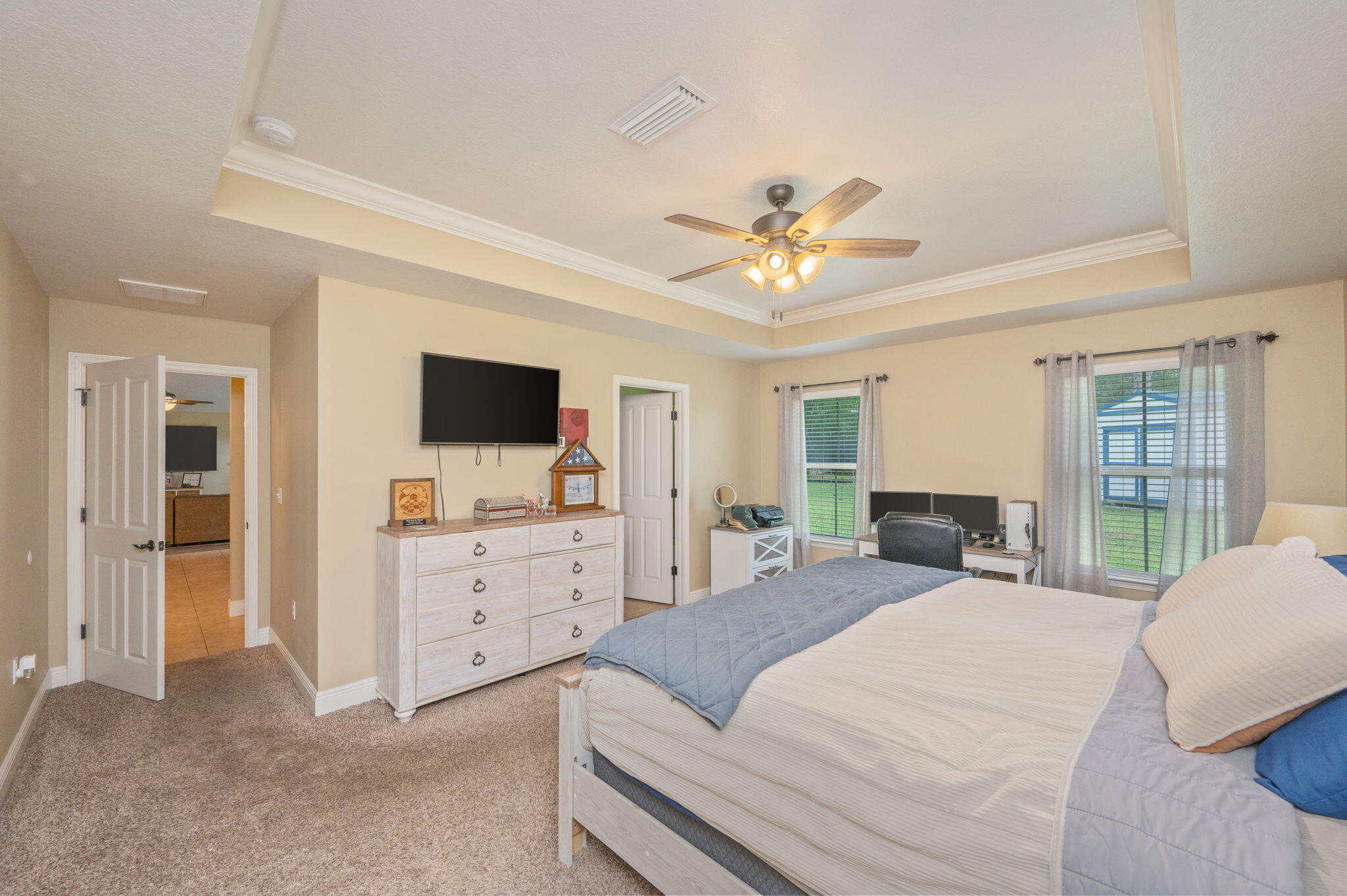 5811 Roberts Road Crestview, FL 32536 - Photo 11 of 17 a spacious bedroom with a bed and a flat screen tv