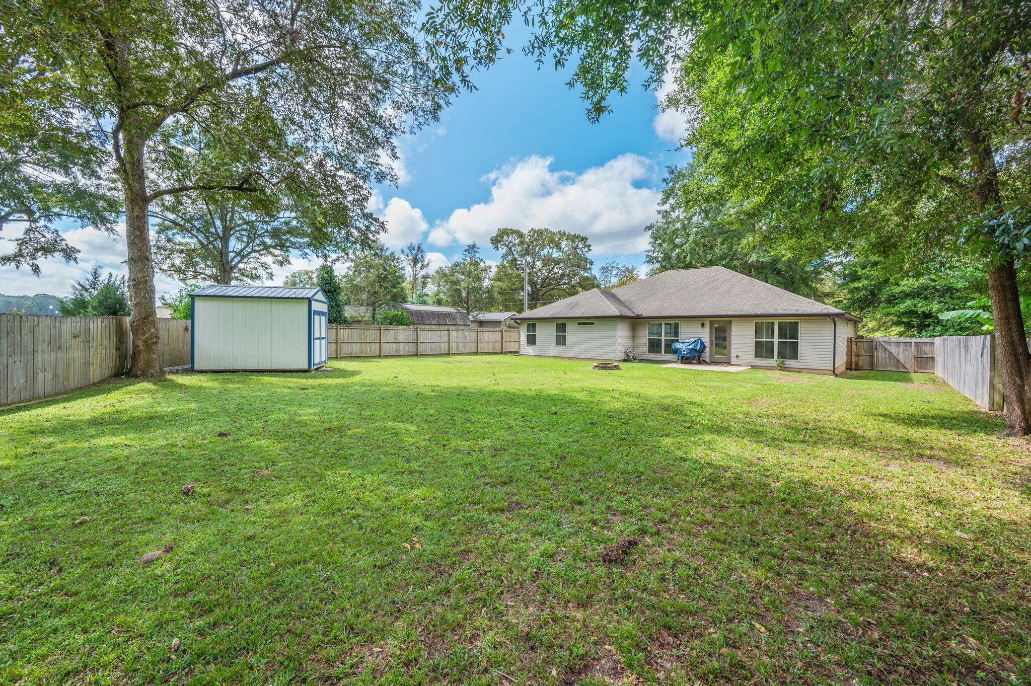 5811 Roberts Road Crestview, FL 32536 - Photo 17 of 17 a front view of a house with garden