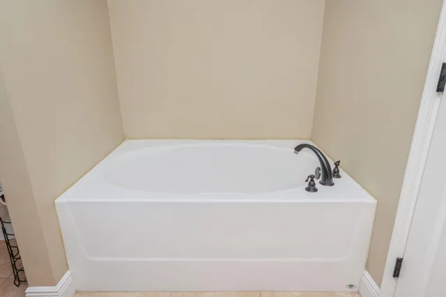 a white bath tub sitting in a bathroom