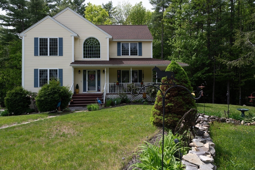 6 Loon Road Winchendon, MA 01475 - Photo 36 of 36 a view of a house with a yard and lawn chairs with a fire pit