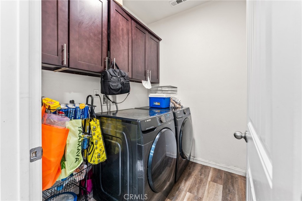 507 Villa Way Colton, CA 92324 - Photo 12 of 34 a view of walk in closet with clothes and shoes