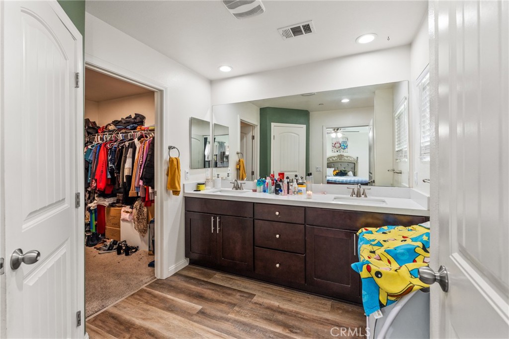 507 Villa Way Colton, CA 92324 - Photo 18 of 34 a view of a hallway with a dining table chairs and chandelier