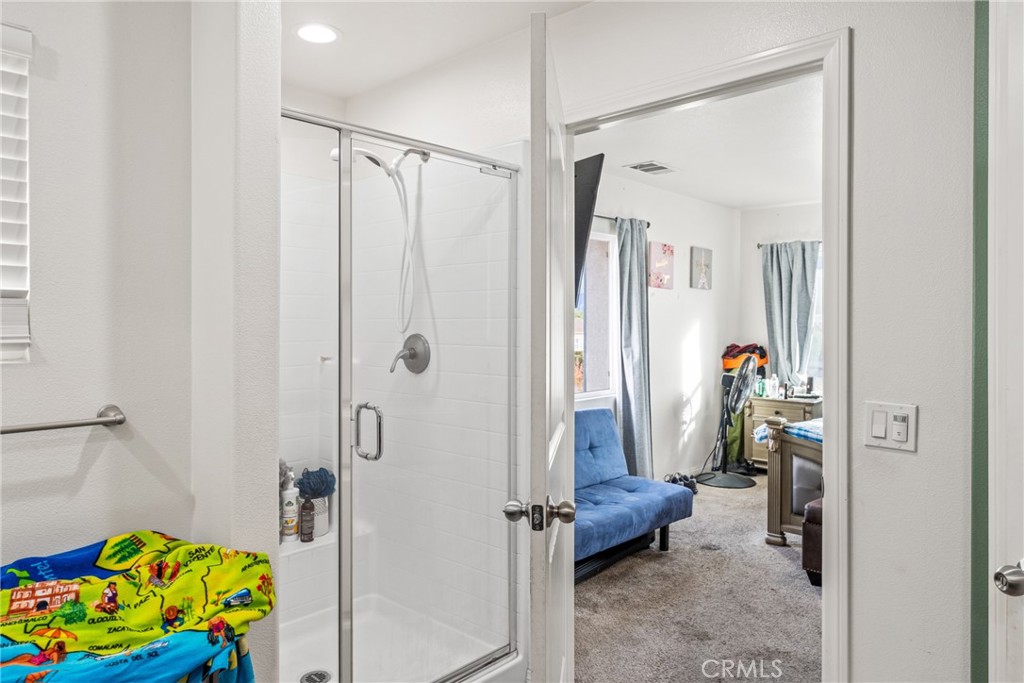 507 Villa Way Colton, CA 92324 - Photo 19 of 34 a bathroom with a shower and a tub