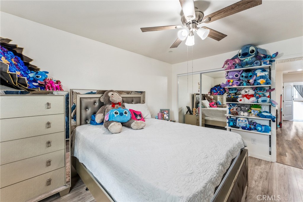 507 Villa Way Colton, CA 92324 - Photo 22 of 34 a bedroom with a bed and a window