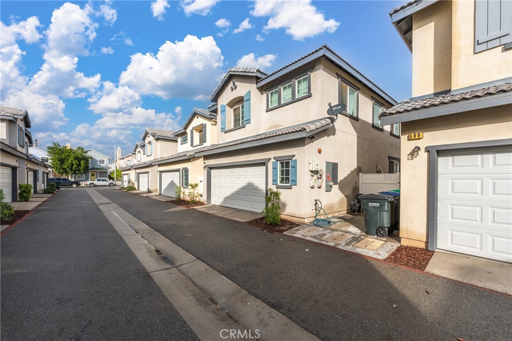507 Villa Way Colton, CA 92324 - Photo 29 of 34 a front view of a house with a road