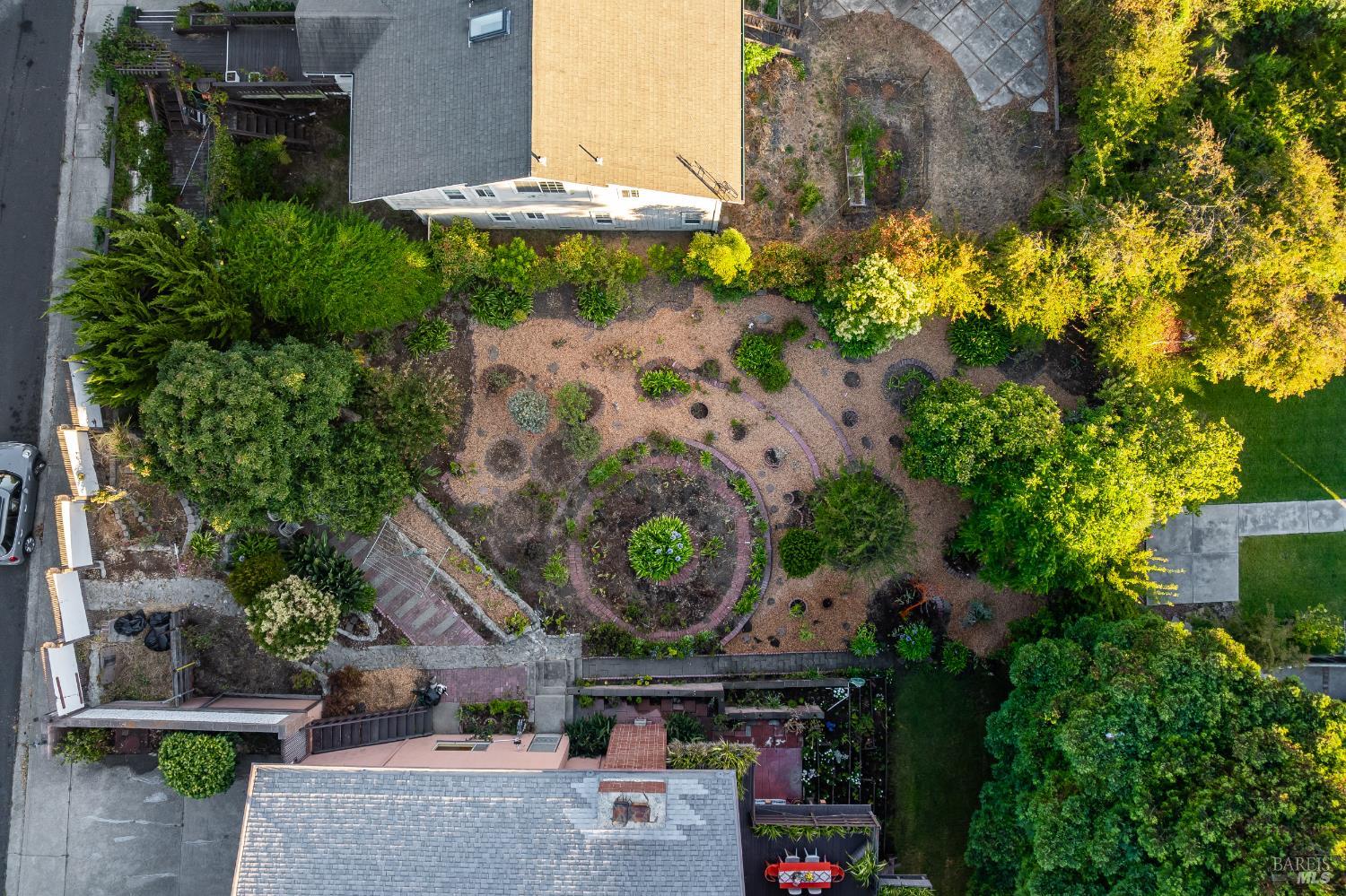 an aerial view of a house with a yard