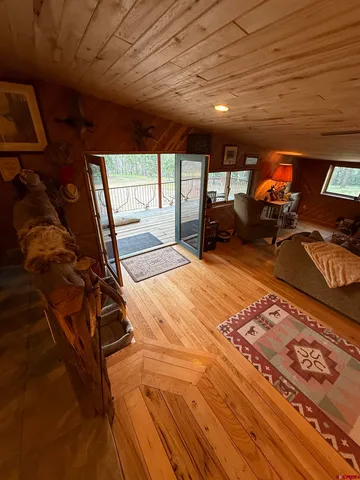 a bed sitting in a room next to a window