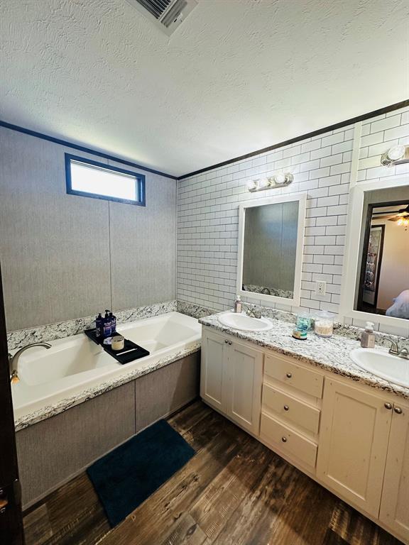 201 Rock Creek Road, Unit 14 Graford, TX 76449 - Photo 9 of 18 a bathroom with a sink and mirror