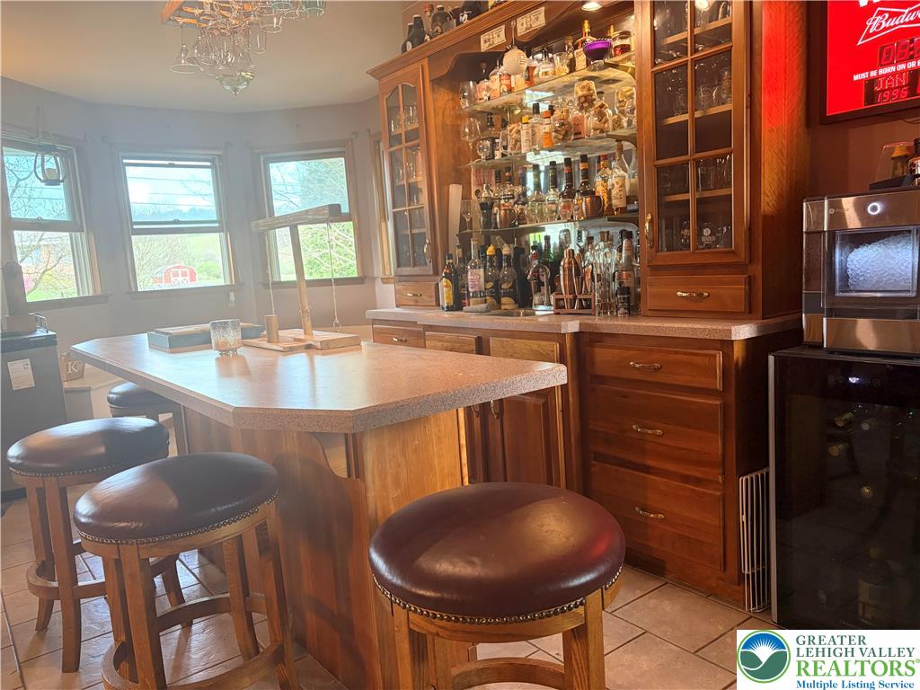 100 Hazelwood Road Lehighton, PA 18235 - Photo 8 of 31 a kitchen with stainless steel appliances granite countertop a table chairs and a sink