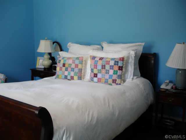 1007 Horsepen Road Richmond, VA 23229 - Photo 7 of 8 a bedroom with a bed and a lamp on table