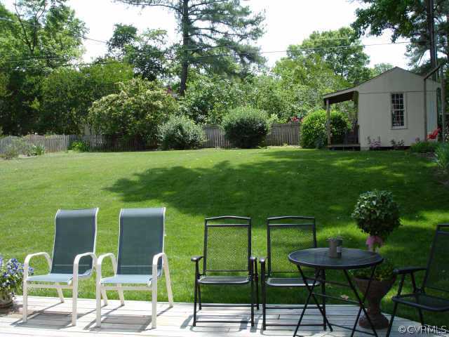 1007 Horsepen Road Richmond, VA 23229 - Photo 8 of 8 a backyard of a house with table and chairs