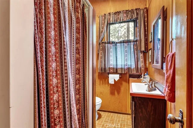 a bathroom with a window and a sink