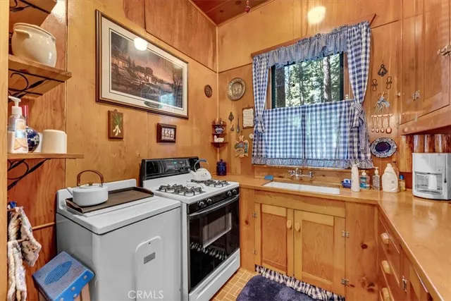 a kitchen that has a stove and a microwave