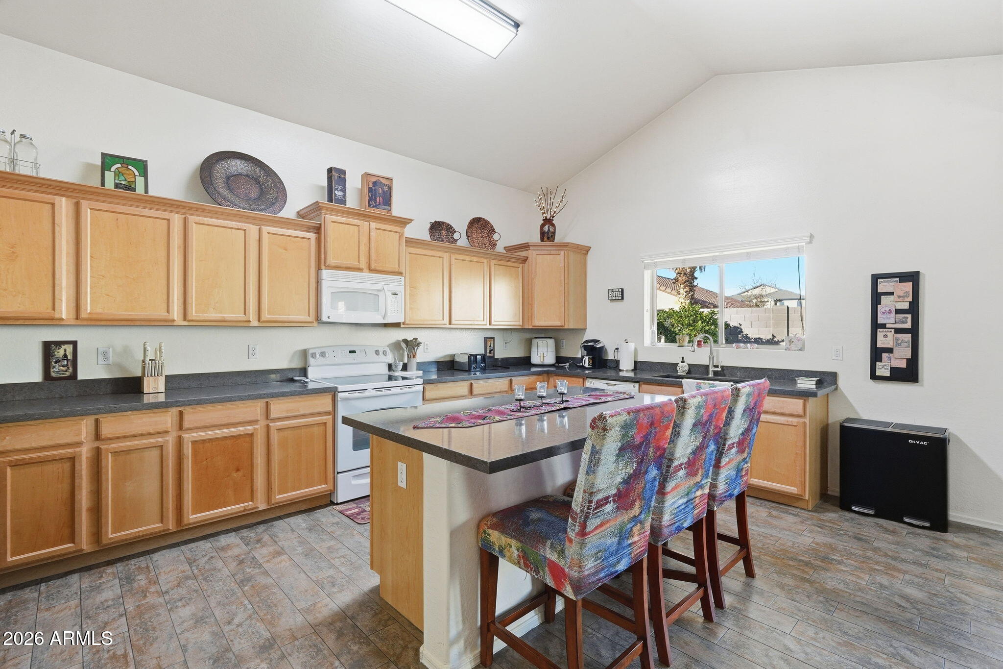 17760 West Charter Oak Road Surprise, AZ 85388 - Photo 13 of 45 a large kitchen with a table and chairs in it