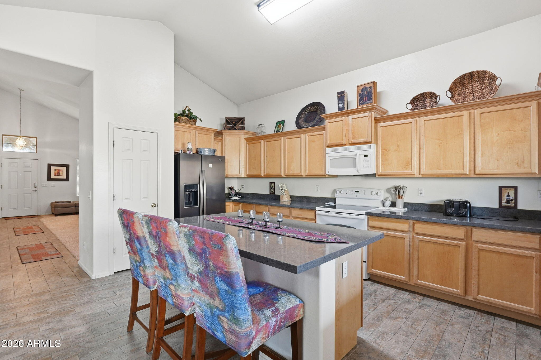 17760 West Charter Oak Road Surprise, AZ 85388 - Photo 14 of 45 a kitchen that has a table and chairs in it