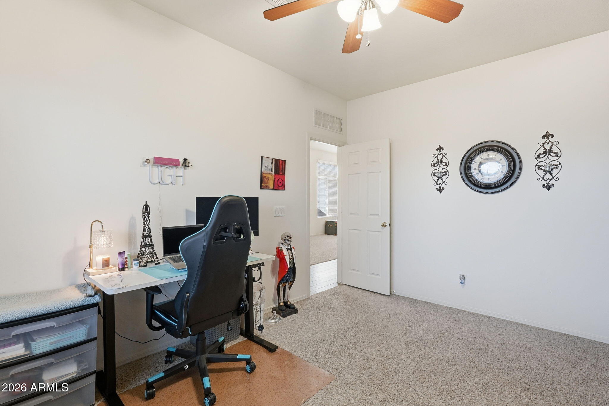 17760 West Charter Oak Road Surprise, AZ 85388 - Photo 20 of 45 a workspace with a couch