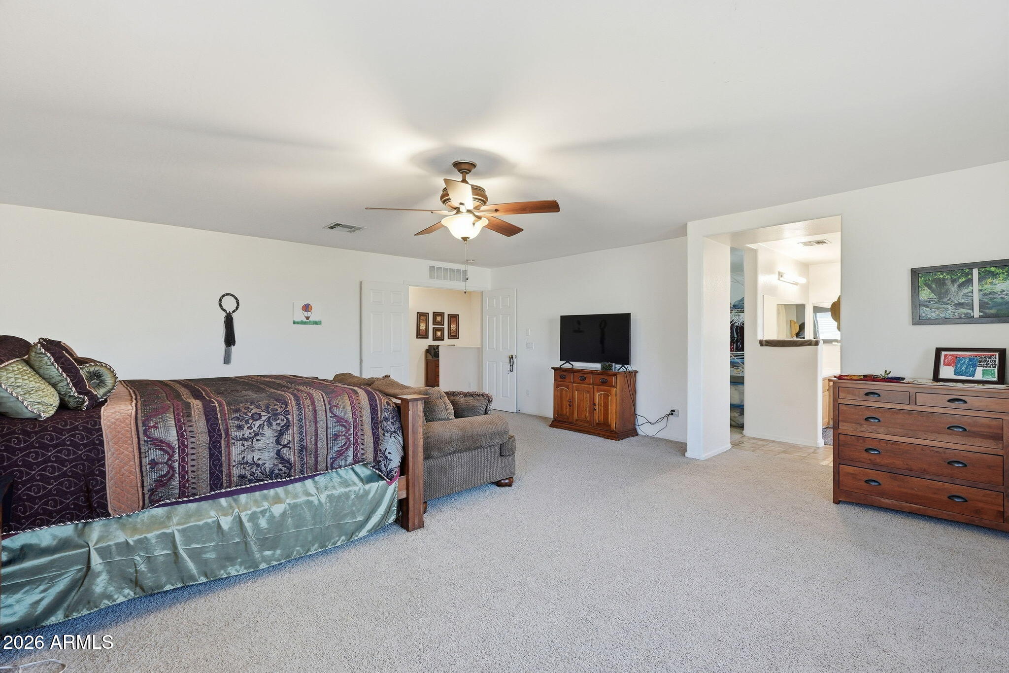17760 West Charter Oak Road Surprise, AZ 85388 - Photo 23 of 45 a living room with furniture and a flat screen tv