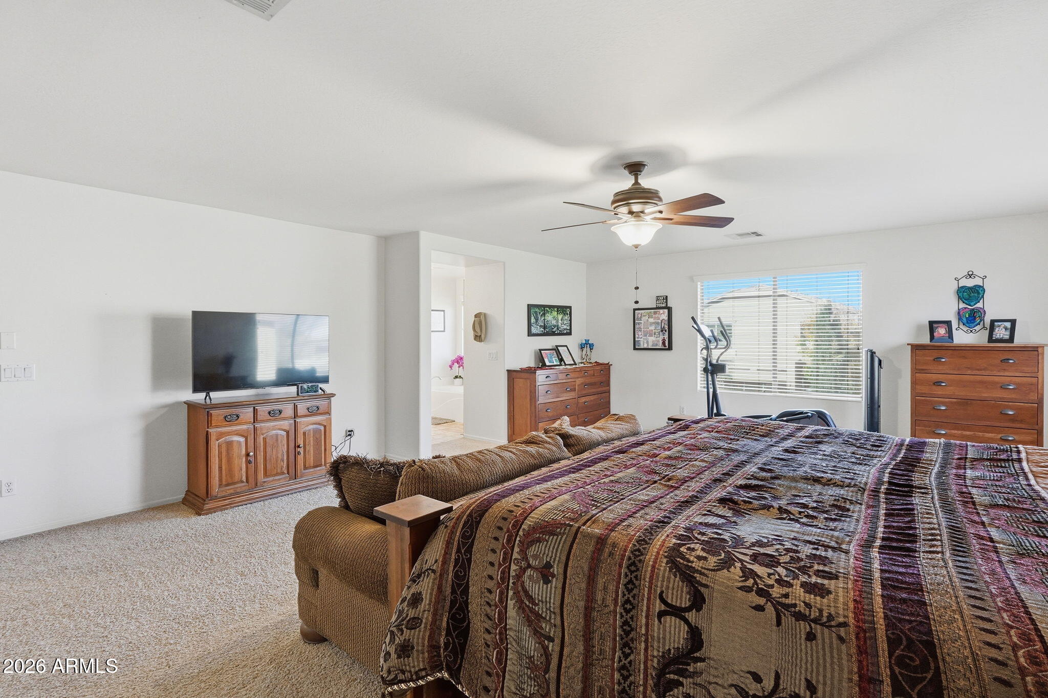 17760 West Charter Oak Road Surprise, AZ 85388 - Photo 24 of 45 a bed room with a bed and a television