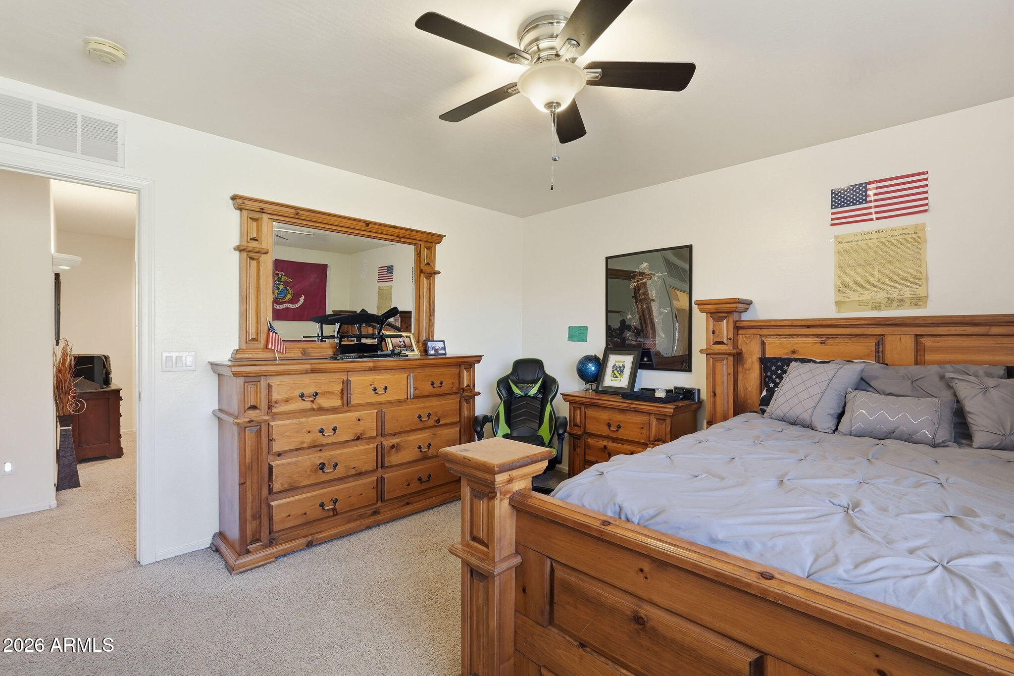 17760 West Charter Oak Road Surprise, AZ 85388 - Photo 27 of 45 a bedroom with a bed and a dresser