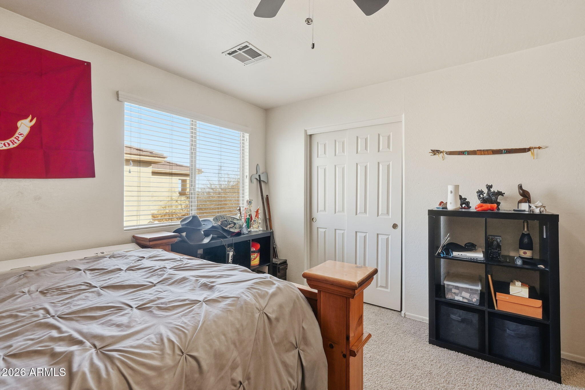 17760 West Charter Oak Road Surprise, AZ 85388 - Photo 28 of 45 a bedroom with a bed and a window