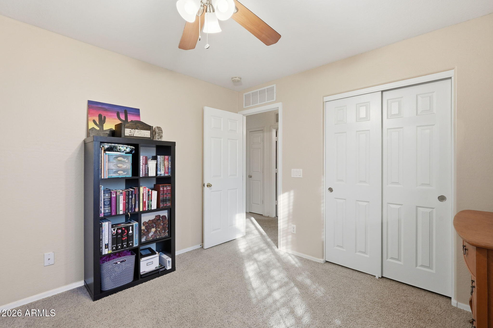 17760 West Charter Oak Road Surprise, AZ 85388 - Photo 30 of 45 a view of a livingroom with a bookshelf