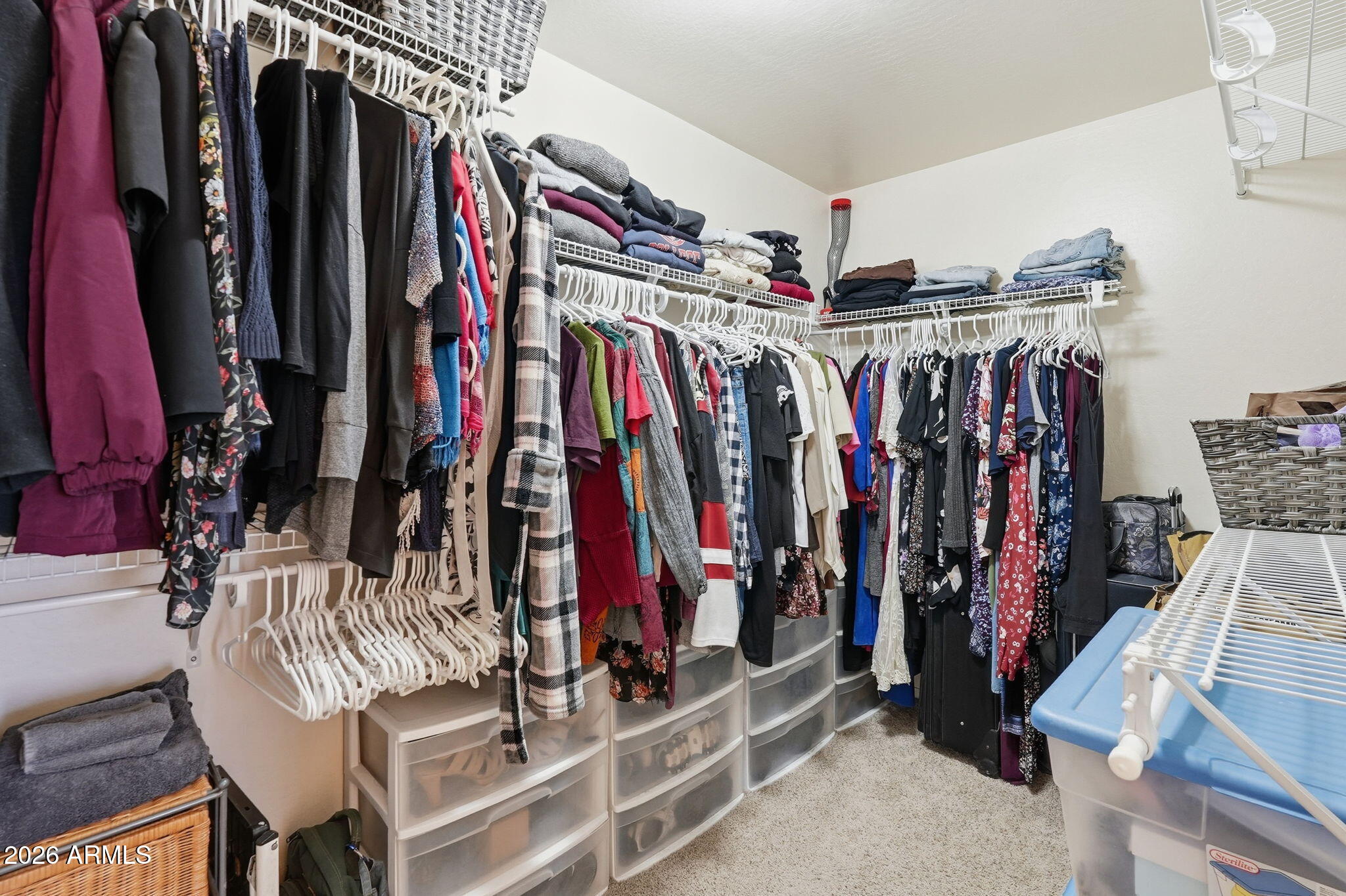 17760 West Charter Oak Road Surprise, AZ 85388 - Photo 34 of 45 a view of walk in closet with clothes