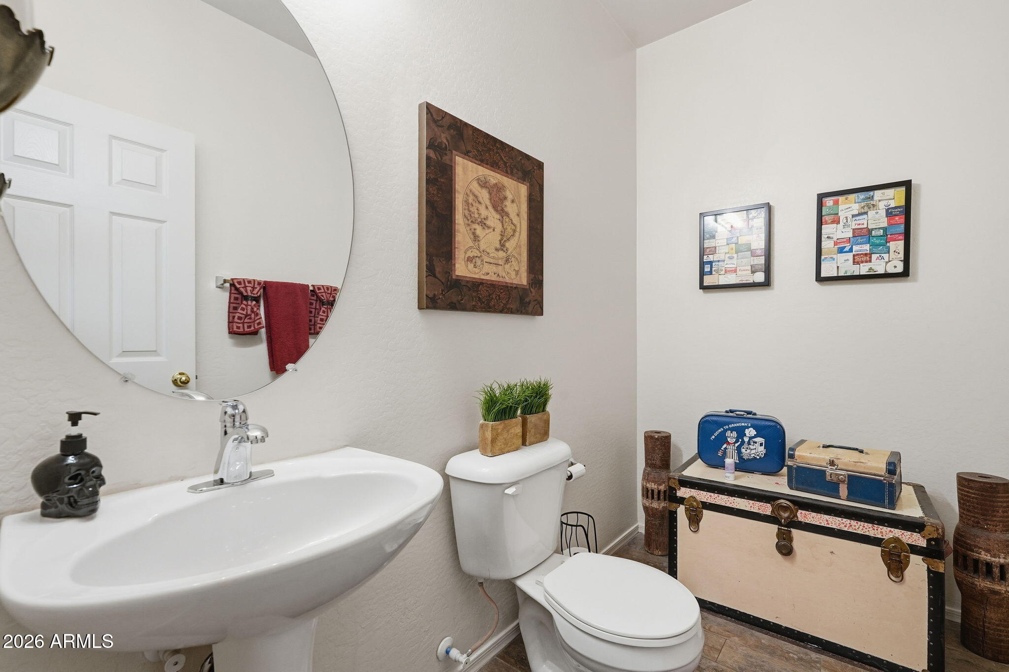 17760 West Charter Oak Road Surprise, AZ 85388 - Photo 35 of 45 a bathroom with a sink mirror and toilet