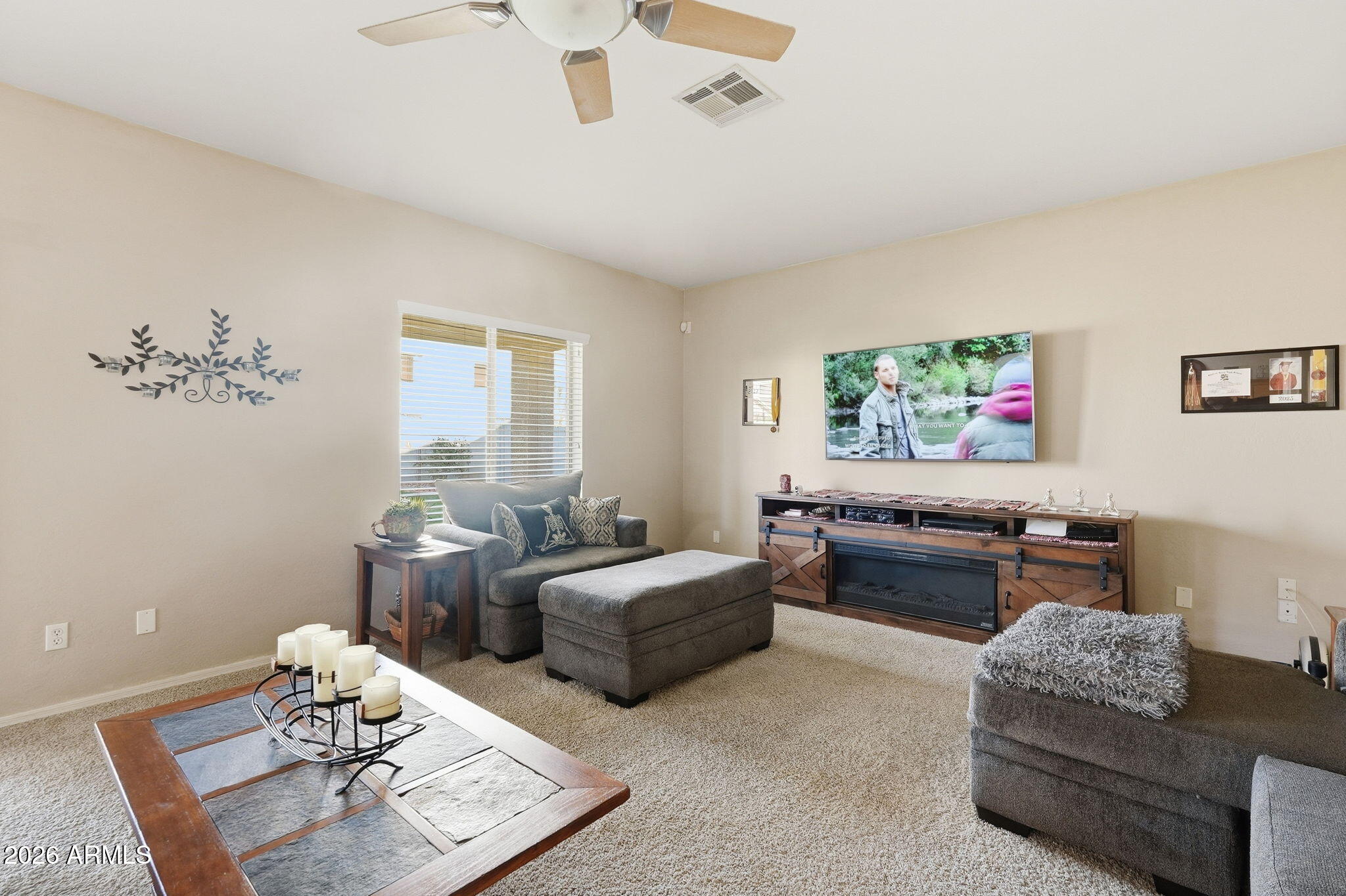 17760 West Charter Oak Road Surprise, AZ 85388 - Photo 9 of 45 a living room with furniture and a window